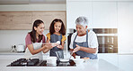 Women in kitchen teaching girl baking cake or cookies for family. Happy grandmother, mom and young child learning with cooking ingredients in family home, make snack, biscuit or flour while have fun
