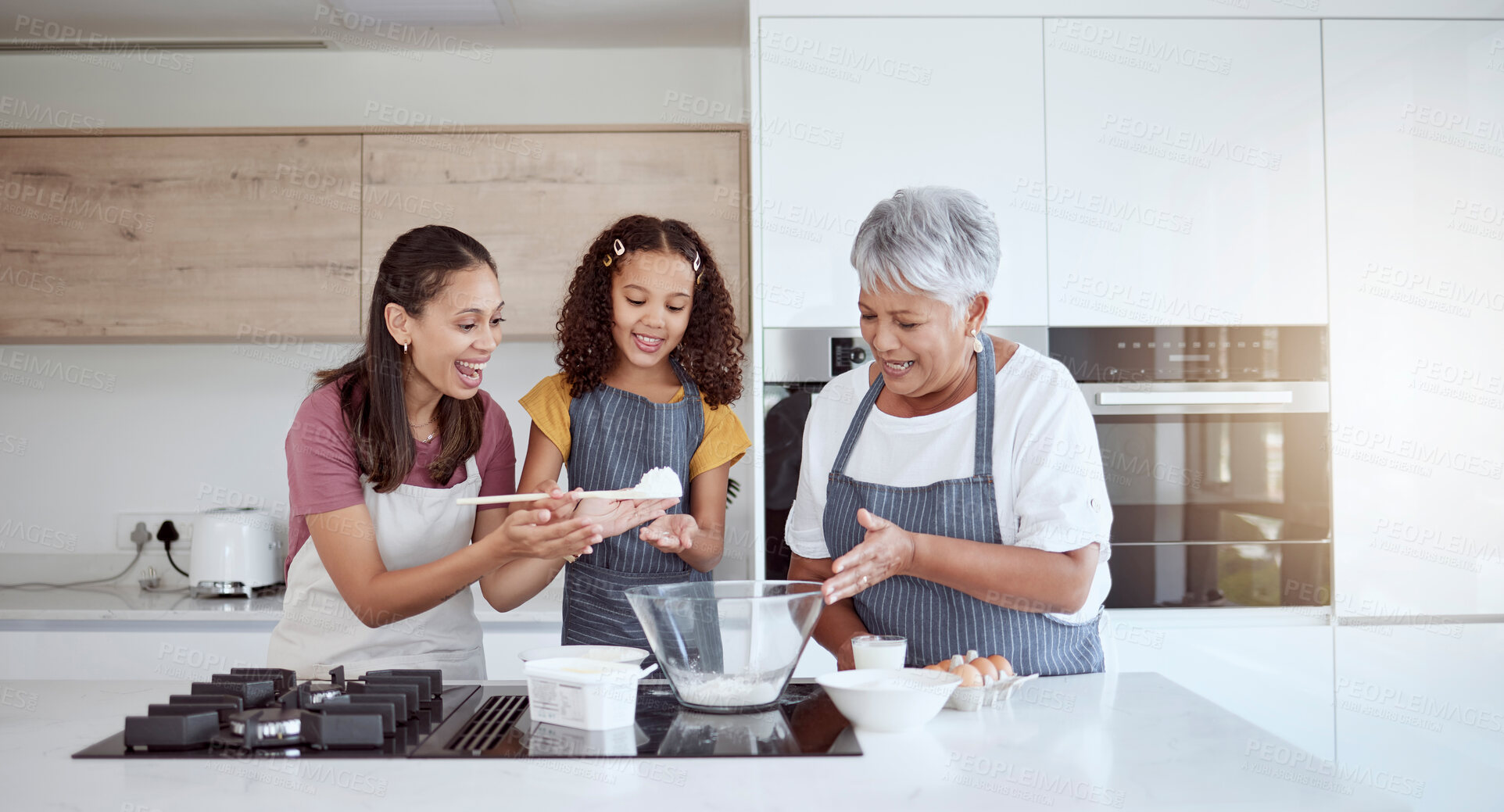 Buy stock photo Women in kitchen teaching girl baking cake or cookies for family. Happy grandmother, mom and young child learning with cooking ingredients in family home make snack, biscuit or flour while have fun
