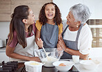 Happy family, cooking and learning with happy, smiling girl bonding with her mother and grandmother in a kitchen. Love, teaching and baking by retired grandparent enjoying fun activity with child