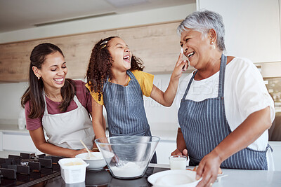 Buy stock photo Women, happy family and bake food in kitchen smile together love cooking dessert and bonding at family home. Excited, happiness and smiling elderly grandmother, mom and girl kid baking fun at house