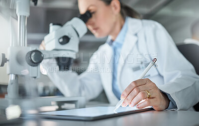 Buy stock photo Science research, lab tablet and scientist working on analysis of virus with microscope and writing on technology at work. Medical technician in pharmaceutical development and biotechnology online