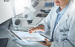 Science, microscope and tablet, woman in laboratory doing research in hospital in Switzerland. Technology, medical innovation and a university lab worker or scientist looking at information online.