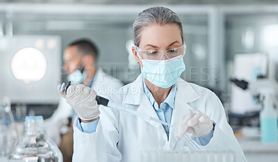 Buy stock photo Covid, lab mask and vaccine research woman with medicine analysis test tube in a lab. Medical development, innovation and professional science expert working on new medical analytics in a laboratory