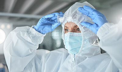 Buy stock photo Covid, science ppe and innovation scientist with glasses and face mask safety for laboratory research, corona virus compliance investigation or test. Healthcare woman expert in hazmat suit for trust