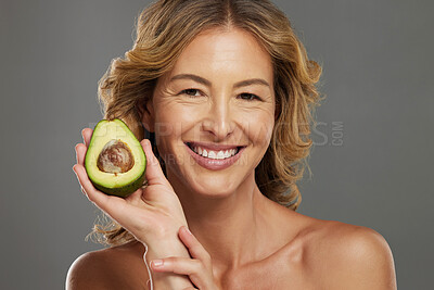 Buy stock photo Skincare, avocado and smile on face of woman with fruit in hand for health, wellness and care. Model, skin and happy with avo in hand for healthy body, hair and beauty with facial product from nature