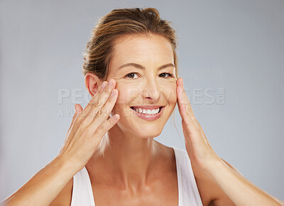 Buy stock photo Face wellness, skincare and mature woman with smile for healthy skincare against a grey mockup studio background. Portrait of happy model with facial skin beauty and cosmetics for healthcare