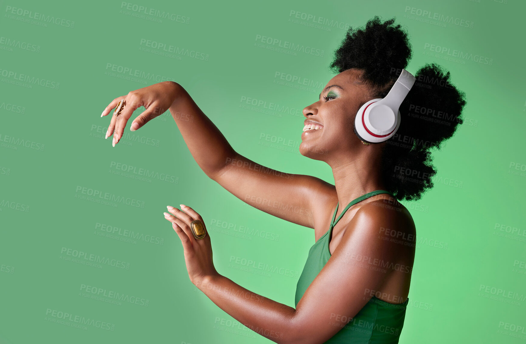Buy stock photo Dance, studio and black woman dancing to music in headphones while streaming happy audio sounds from a playlist. Freedom, smile and young African girl enjoying listening to radio with mockup space