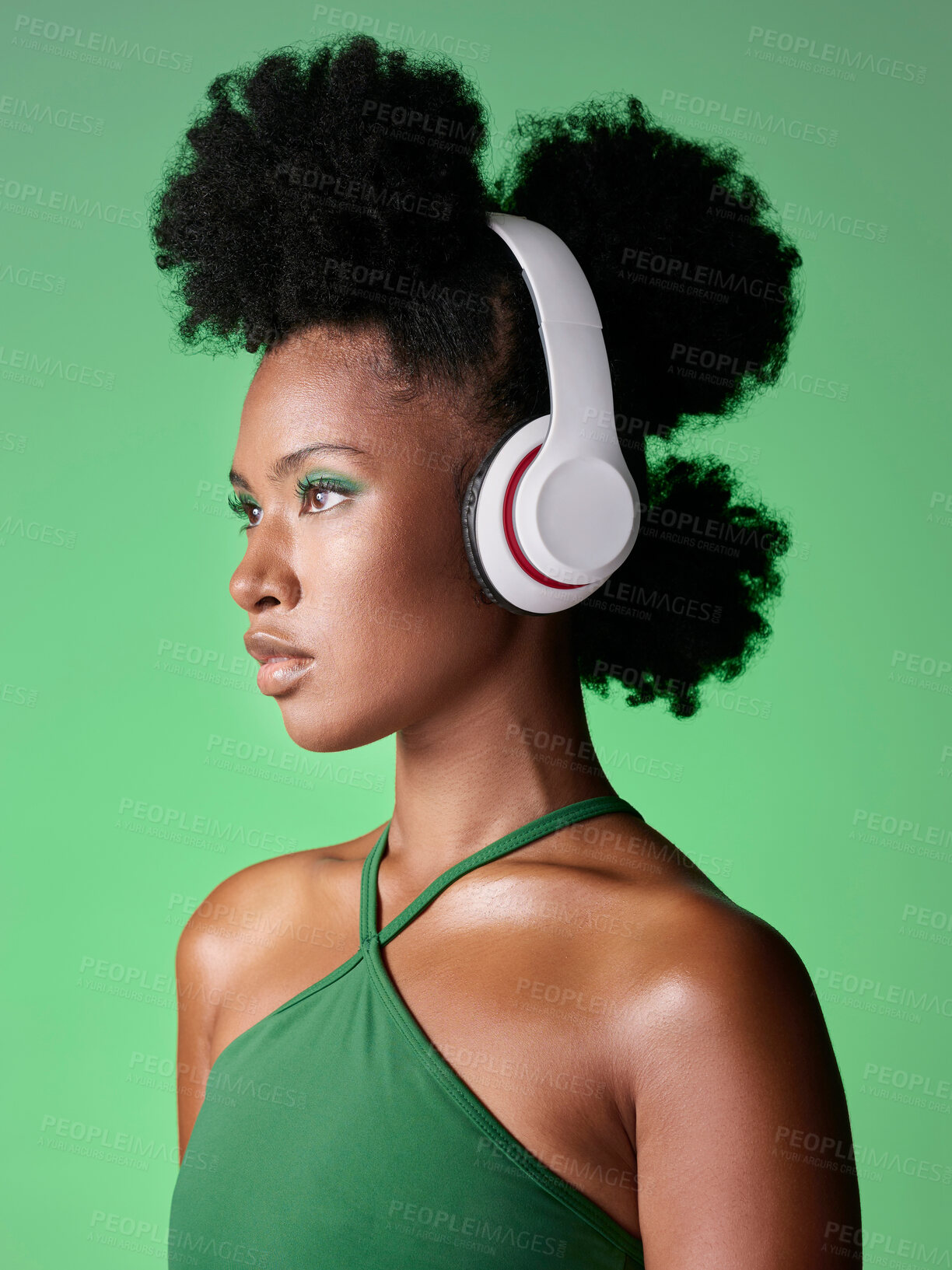 Buy stock photo Black woman with headphones listening to music or podcast on green studio background mockup advertising and marketing. African gen z girl with audio for youth lifestyle or streaming service mock up