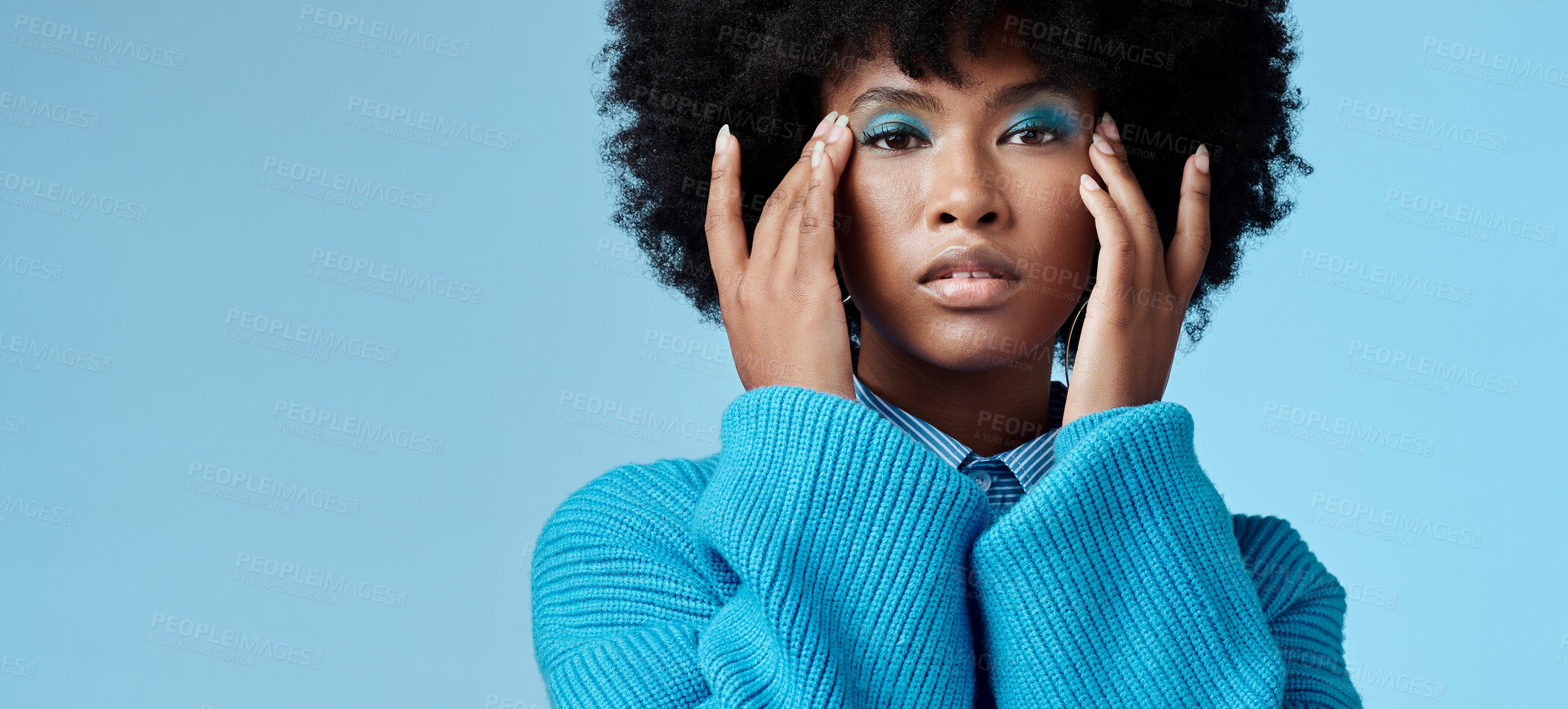 Buy stock photo Blue makeup, fashion and beauty with a black woman in studio against a wall background with mockup. Cosmetics, face and eye shadow with a young female posing for contemporary or edgy style