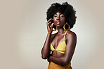 Beauty, fashion and makeup with a black woman model in studio on a gray background with mockup. Cosmetics, style and afro hair with a young female posing for real, natural or body positive confidence