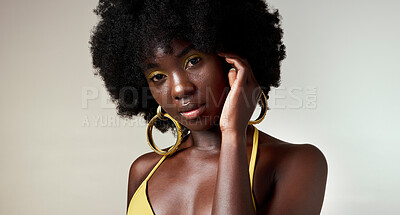 Buy stock photo Black woman, face and makeup with skincare beauty and cosmetics against grey backdrop. Model, hand and hair, show afro, skin wellness and health in portrait against studio background in Los Angeles