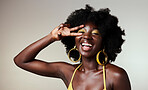 Beauty of a black woman, healthy skincare with gold makeup and jewelry accessory in mockup studio background. A happy model with afro, creative cosmetic designer backdrop and black people empowerment