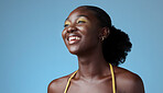 Smile, young and black woman fearless, happy and relax with a studio background with cosmetics. African American girl, lady or female shows empowerment, proud and black girl magic with makeup on face