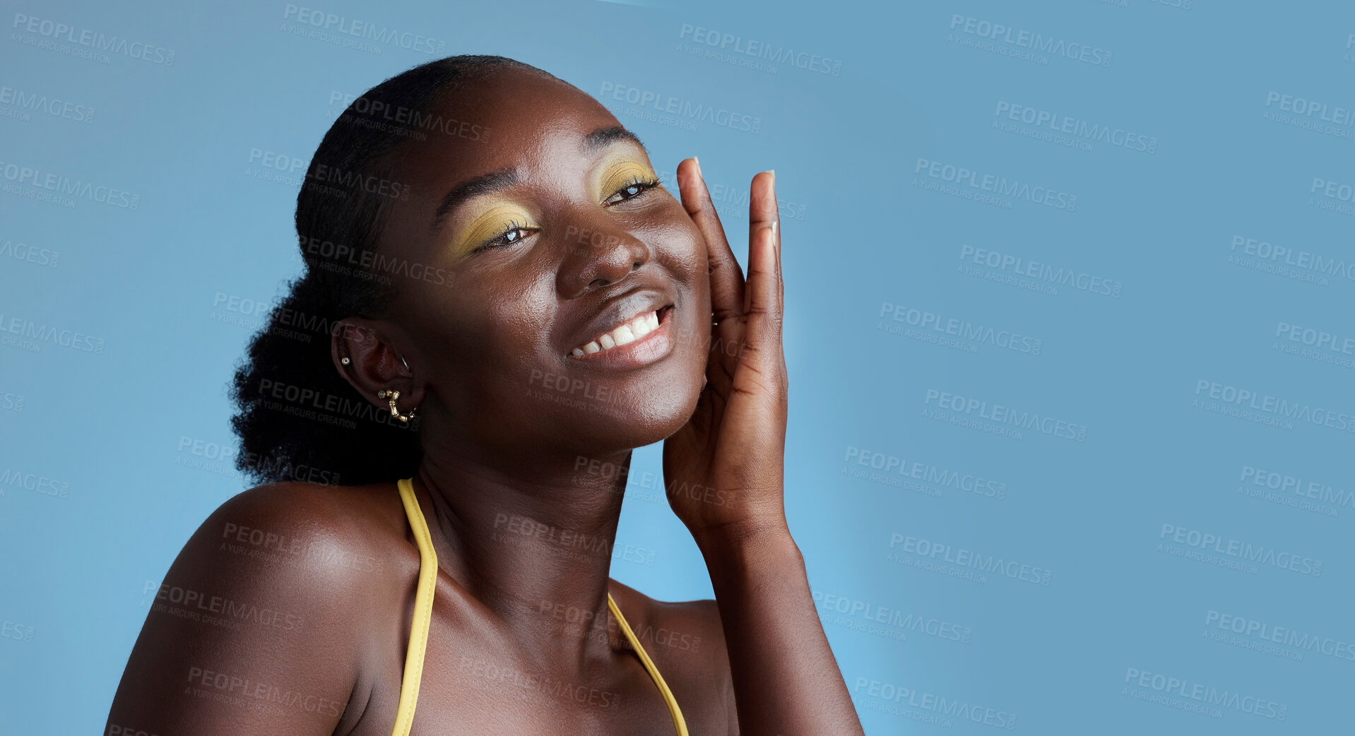 Buy stock photo Yellow makeup and black woman face beauty for skincare  cosmetic product with blue studio wall. Thinking, contemplating and pensive African girl feeling soft skin texture with eyeshadow mockup.