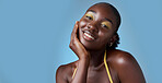 Black woman, smile and makeup in mockup for skincare beauty and cosmetics against blue backdrop. Model, happy and hand on face, for skin wellness and health in portrait against studio background