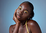 Face makeup, creative portrait and black woman with glow from cosmetics against a blue mockup studio background. African model with beauty from cosmetic art and clean body care with mock up space