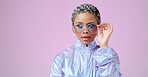 Fashion, beauty and mockup with a black woman in glasses on a pink background in studio for advertising and marketing. Style, edgy and trendy with an attractive female posing for product placement