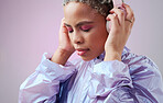 Fashion, headphones and black woman listening to music with retro vaporwave clothes on studio pink background. Gen z girl model with color cosmetics and audio technology for youth mockup advertising