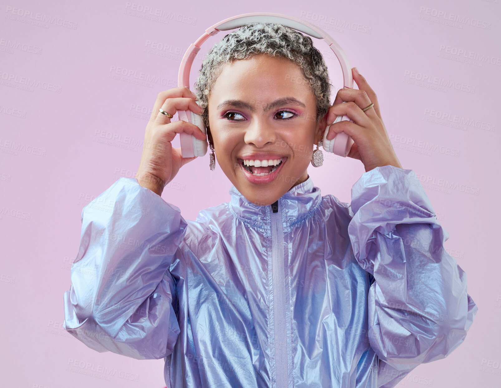 Buy stock photo Black woman and holding headphones in studio for music streaming entertainment with pink wall. Mockup pink background with happy, funky and edgy african fashion girl enjoying bluetooth audio.