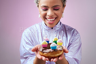 Buy stock photo Happy birthday donut, black woman with cupcake candles and hands holding sweet dessert in New York. Anniversary celebration cake, young cool girl smile in studio with pink background and solo party