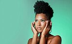 Model, eyes and makeup with hands on face with manicure jewelry and beauty against green fashion backdrop. Black woman, cosmetics and hair with glow on skin against studio background in New York
