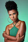 Fashion, beauty and makeup with a confident black woman in studio on a green background for style and empowerment. Portrait, cosmetics and equality with a young female standing arms crossed inside