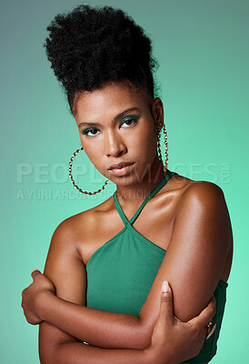 Buy stock photo Fashion, beauty and makeup with a green background and black woman in studio for style and empowerment. Portrait, cosmetics and equality with a confident young female standing arms crossed inside