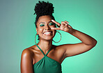 Peace sign hand, fashion and black woman on green studio background mockup with cosmetics and a bright smile. Happy african Kenya girl or model with color cosmetics and v sign for youth lifestyle