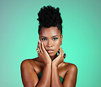 Fashion, beauty and makeup with a black woman or model in studio on a green background for empowerment and equality. Cosmetics, hands and skincare with a beautiful female touching her glowing face