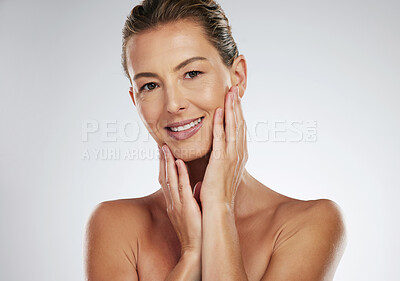 Buy stock photo Face wellness, skincare and mature woman with smile for dermatology against a grey mockup studio background. Portrait of model for luxury cosmetic spa with natural facial skin care and mock up space