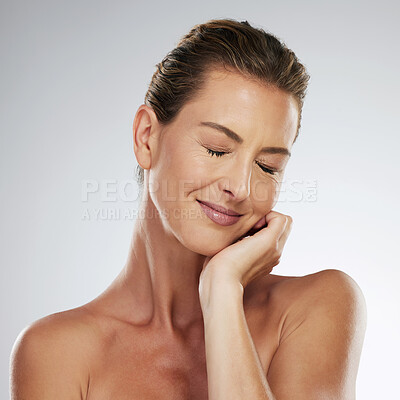 Buy stock photo Mature beauty, woman relax and healthy facial skincare routine at peace in grey mockup studio background. Portrait of natural glowing skin, an elderly woman comfortable in body and cosmetic wellness 