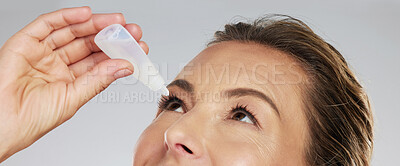 Buy stock photo Woman with eye drops, healthcare and medicine in medical treatment. Tired eyes, glaucoma and allergy relief with zoom and macro shot of mature woman applying medical liquid for optical conjunctivitis