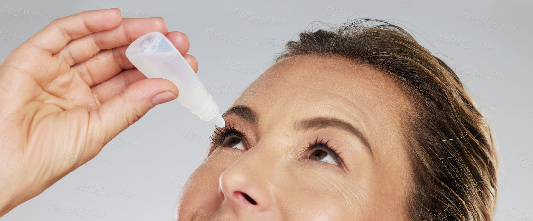 Buy stock photo Woman with eye drops, healthcare and medicine in medical treatment. Tired eyes, glaucoma and allergy relief with zoom and macro shot of mature woman applying medical liquid for optical conjunctivitis