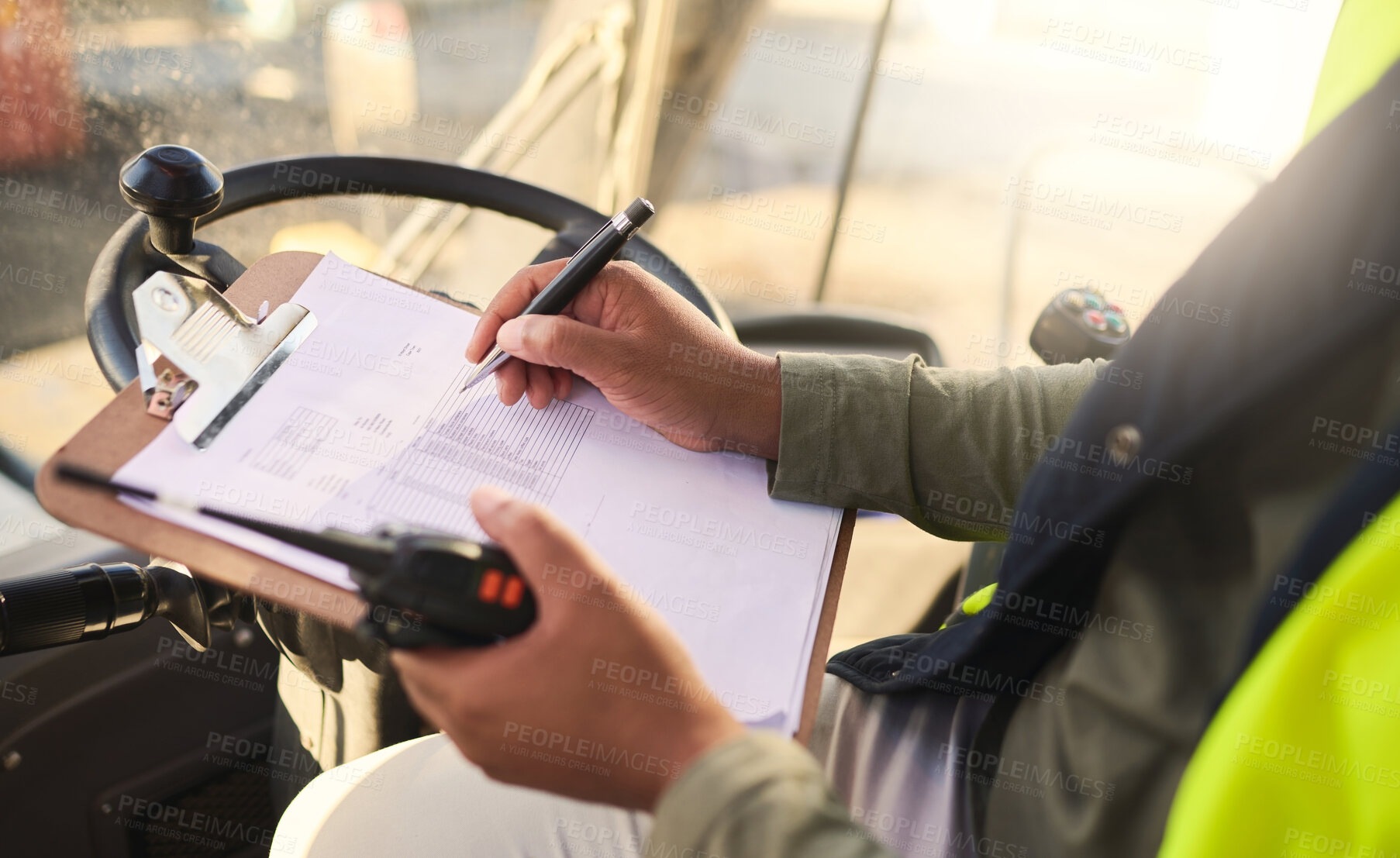 Buy stock photo Forklift driver and writing on checklist for warehouse admin and organisation of stock logistics. Professional cargo worker report schedule and management of tasks paperwork for accountability.


