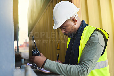 Buy stock photo Logistics, supply chain and documents with a man shipping worker on a commercial container dock with a radio and clipboard. Stock, cargo and freight with a male courier working in the export industry