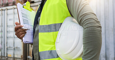 Buy stock photo Man, checklist and work in logistics with helmet by container at port. Black man, notes and pen in hand to check stock while working in shipping, cargo and transportation industry in Cape Town