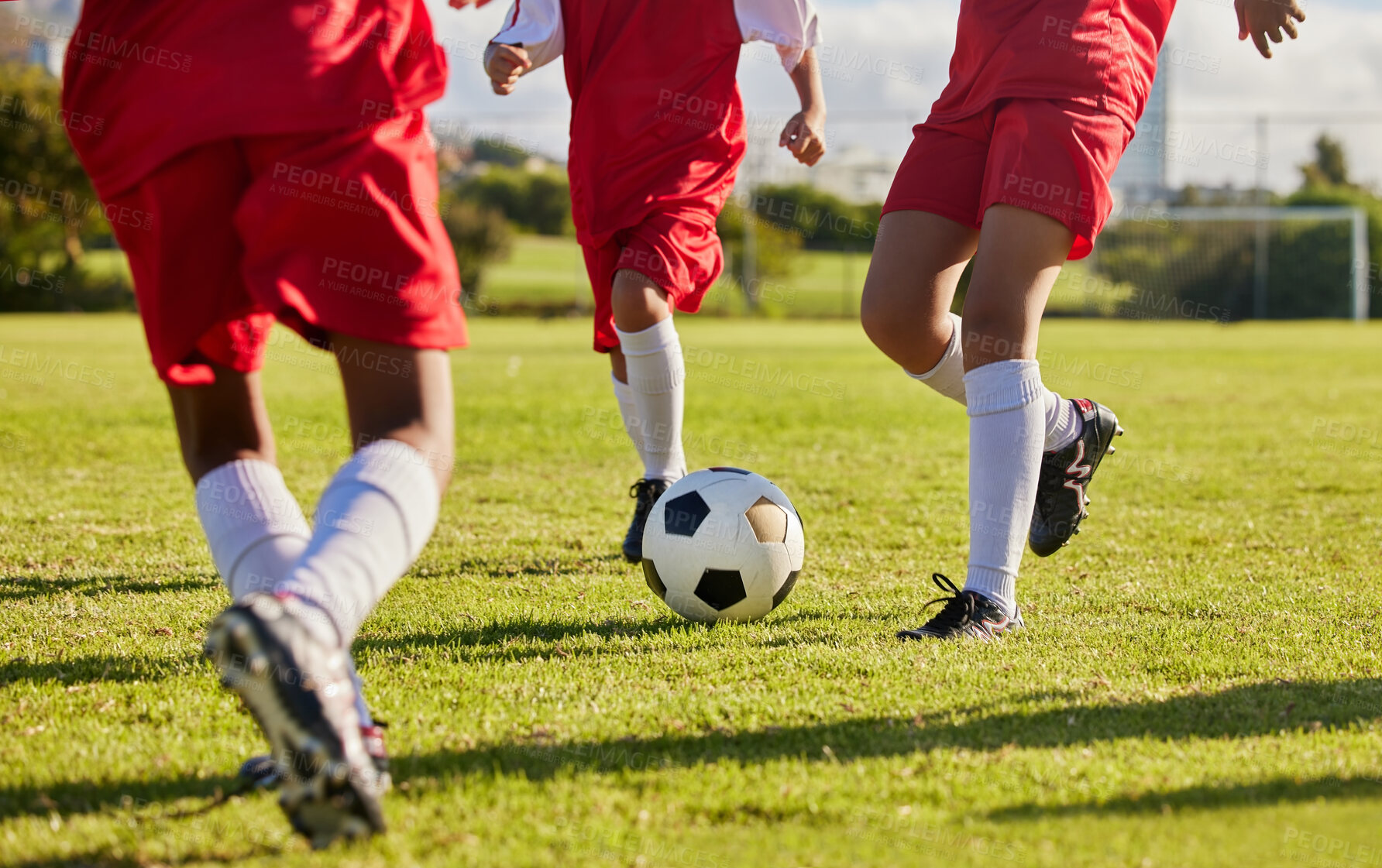 Buy stock photo Kids team, soccer or legs with soccer ball in workout, fitness game or exercise on nature park grass, high school stadium or field. Football or sports training with energy in health or girls wellness