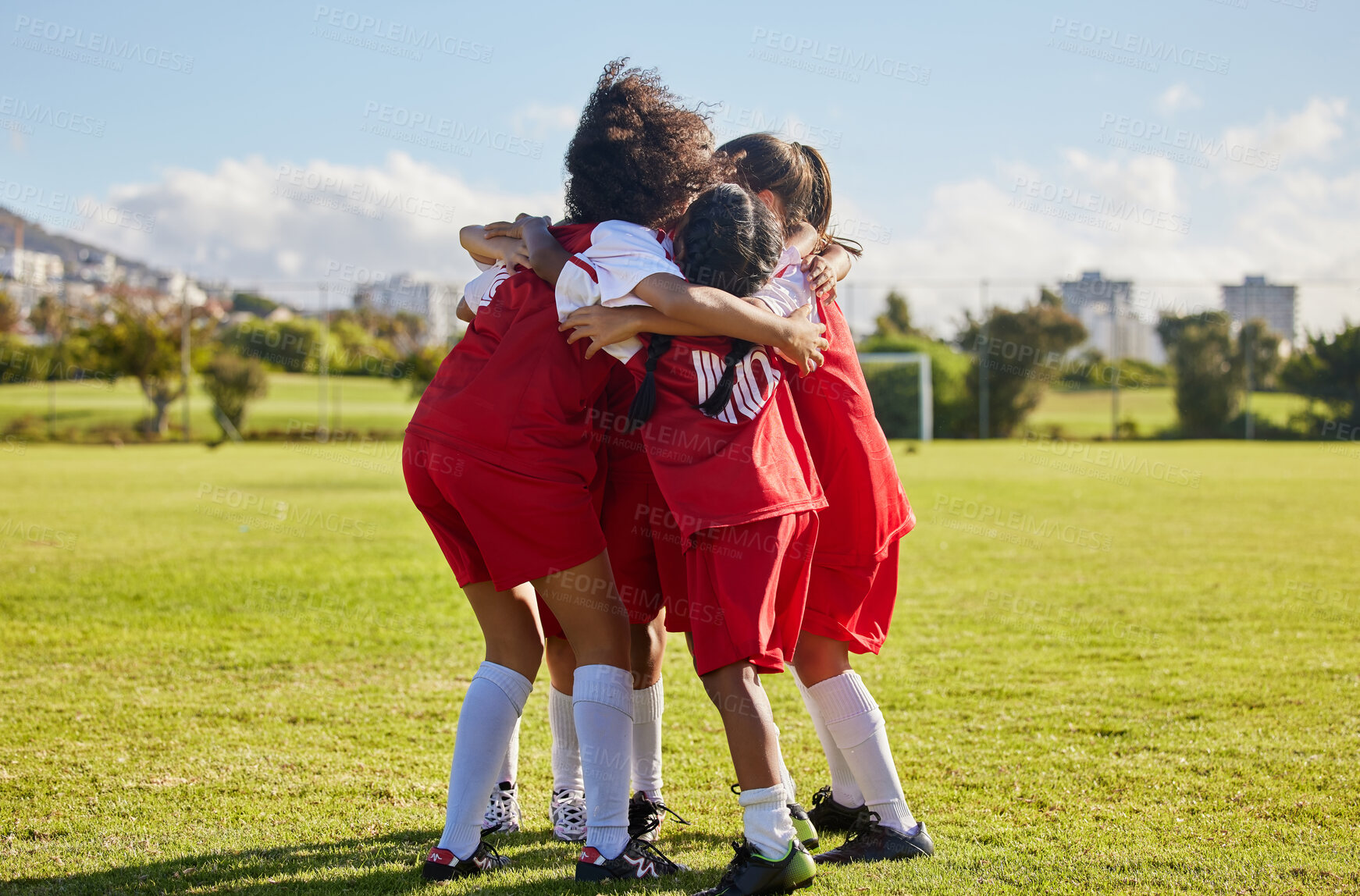 Buy stock photo Children, football team and huddle of sports group together on soccer field for celebration of goal, winning and teamwork during a competition match outdoors. Youth, kids or girls before a tournament
