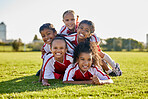 Soccer, training and children on sports field for football game, exercise or cardio together. Portrait of girl kids, athlete group and players with smile and partnership, teamwork and sport at school