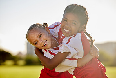 Buy stock photo Girl football players, children hug and smile after sports training match for competition. Young football friends, embrace after game and learning collaboration and teamwork together while exercising