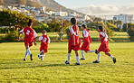 Girl, soccer and fitness team in field sports playing fun game together in training for competition outdoors. Group of female football players in teamwork sport match for health and exercise outside