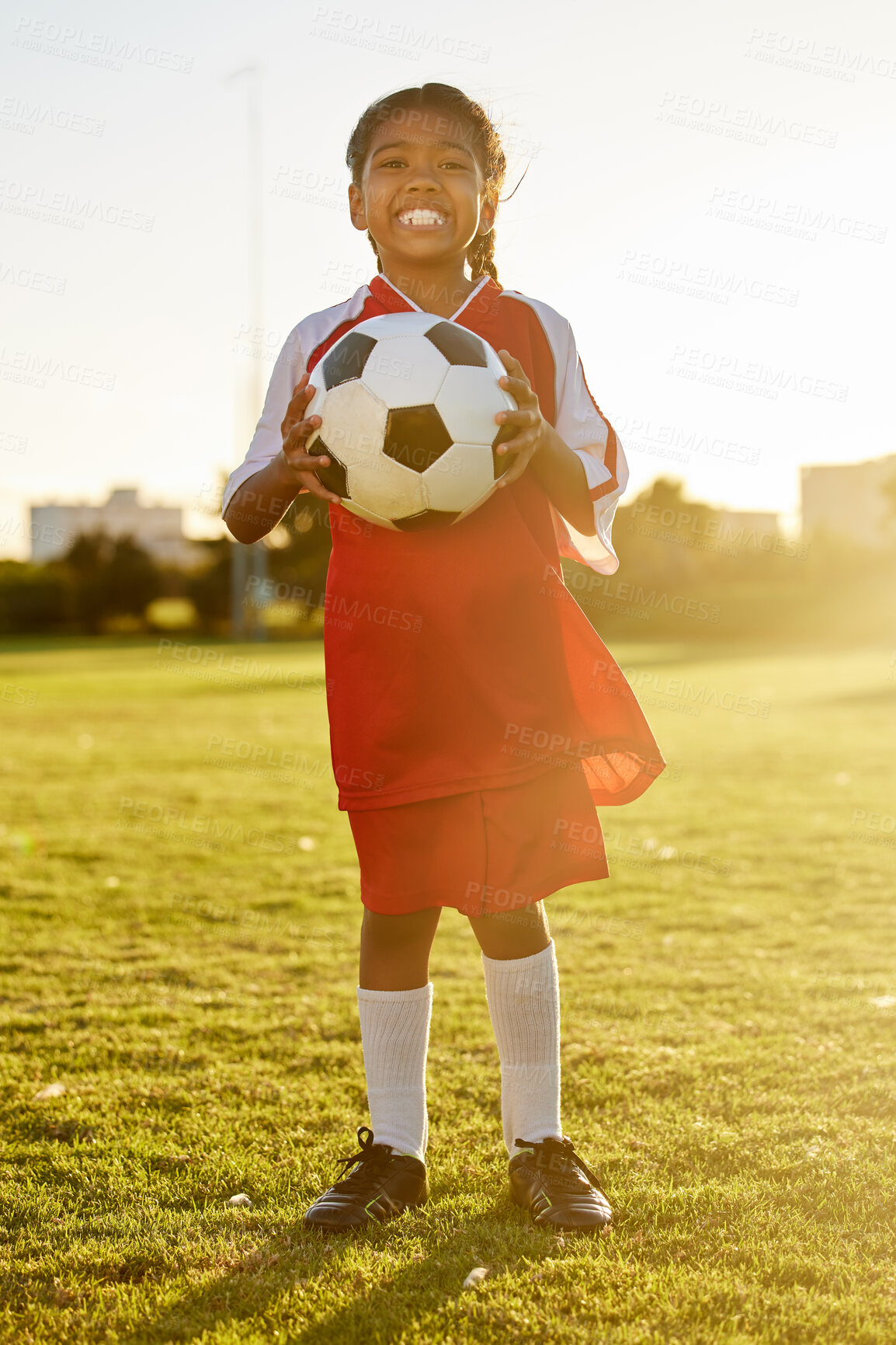 Buy stock photo Football, portrait and girl soccer player on a sports ground ready for a ball game or training match outdoors. Smile, fitness and young kid excited for practice workout on field of grass in Sao Paulo