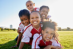 Girl, soccer and team smile on grass together in sports field for kids game in the outdoors. Portrait of happy female children smiling in teamwork success for football sport, fitness and exercise