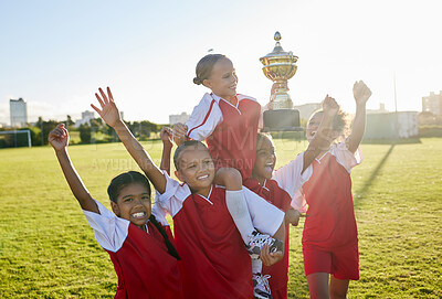 Buy stock photo Sports. soccer and young girls with trophy celebrate, happy and excited outside on field for their victory. Team, players and female children are victorious, winners and champions for their game. 