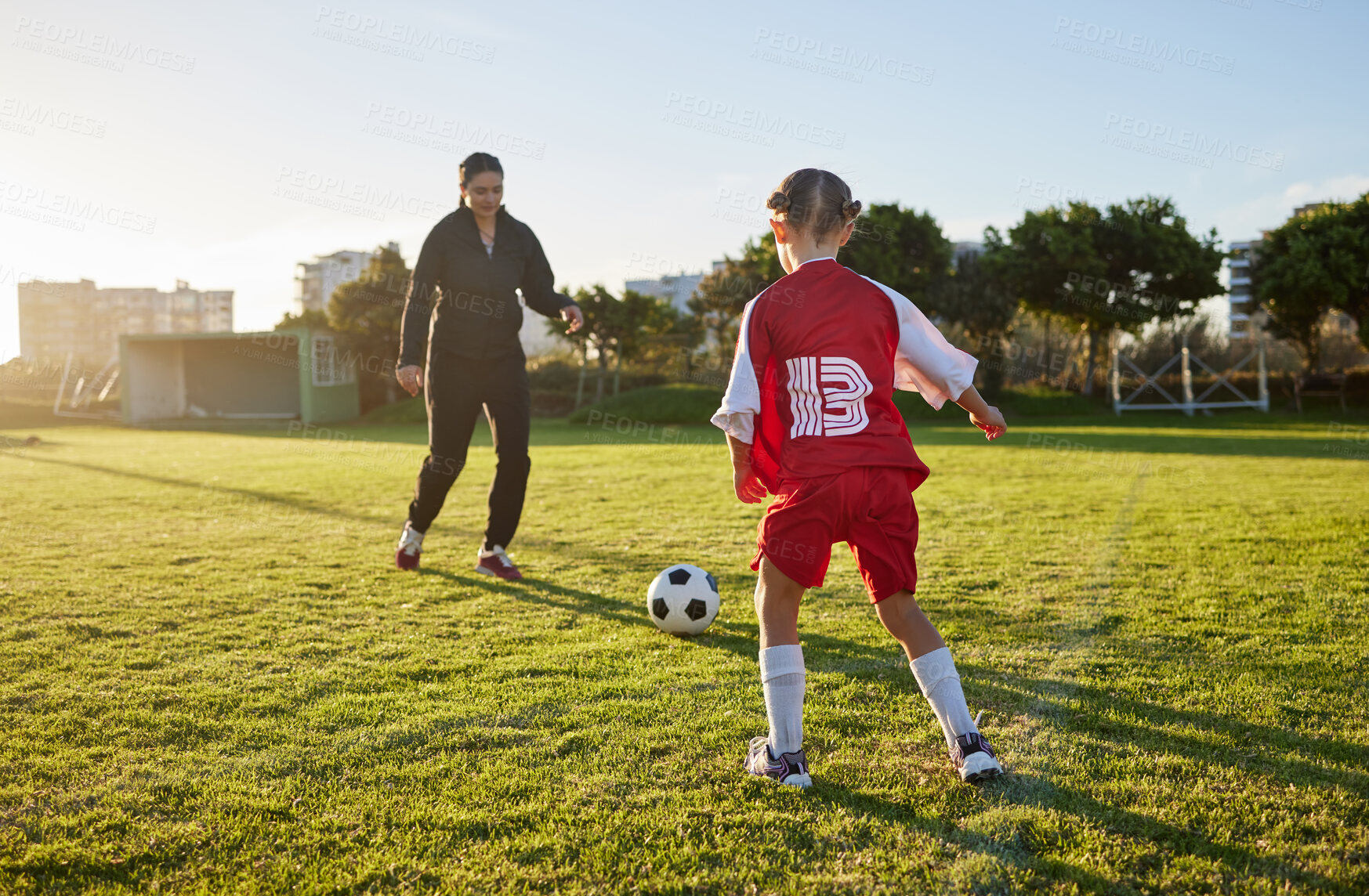 Buy stock photo Soccer, coach and child sport on a outdoor school field with a ball for fitness and exercise. Trainer training a kid student for football training, workout and children sports game kick together