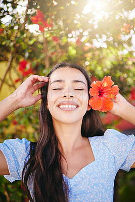 Buy stock photo Girl, tropical flower and garden in summer sunshine on vacation, holiday and spring break in Hawaii. Happiness, wellness and beauty skin care or zen mental health self love, peace, happy and smile.