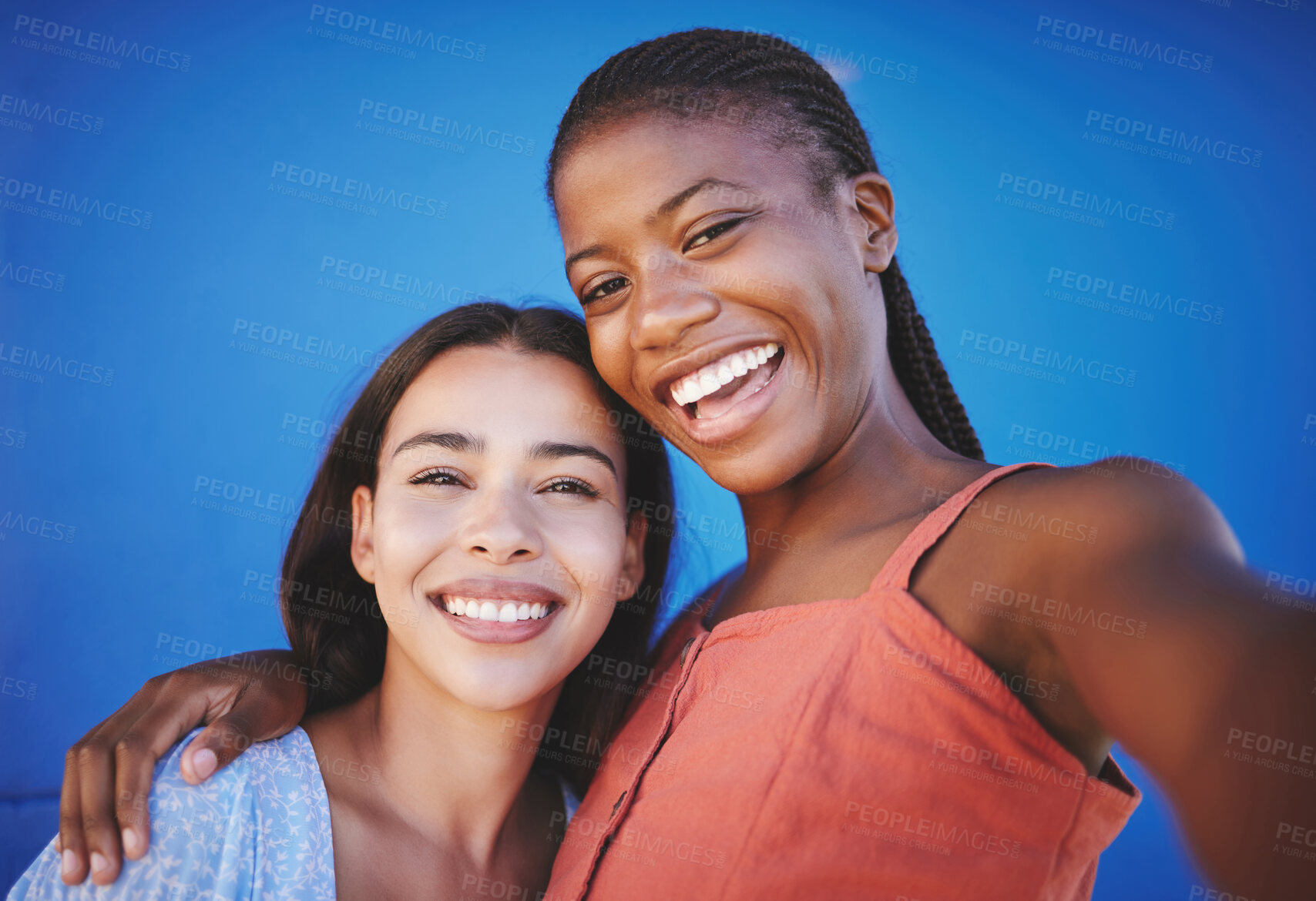 Buy stock photo Friends, smile and happy for selfie against blue background in diversity while embrace. Women, face and beauty hug in portrait while show happiness, solidarity and connection against studio backdrop