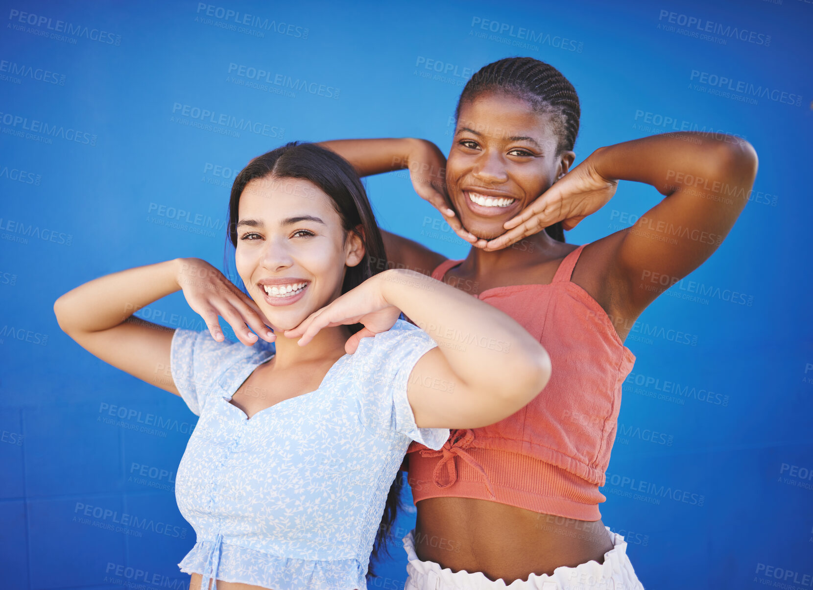 Buy stock photo Cute friends happy in studio, women model fashion together on blue background and enjoy summer with portrait. Friendship diversity with funny smile pose, cool black woman and latino girl in Miami