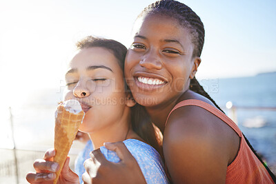 Buy stock photo Ice cream, summer and friends on beach in portrait for holiday or outdoor gen z lifestyle with sunshine and mockup. Happy, diversity teenager women or couple smile eating icecream dessert by the sea