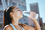 Relax, fitness and water drink girl on hydration break with outdoor summer cardio workout training. Thirsty exercise woman enjoying aqua beverage from bottle to hydrate body for health lifestyle.